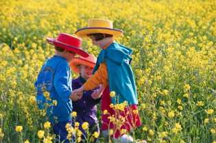 Children playing in field of flowers